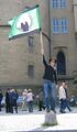 Anonymous know that when being filmed by six Scilons, always remove your mask, jump on a plinth and wave a flag.