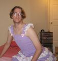 Here Amethe tries on a cute pink frilly dress, she looks sad because you can't see her diaper.