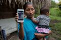 Jakelin's mother, Claudia Maquin, holding a slightly less horribly Photoshopped iPhone.