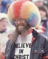 Believe in Christ, receive rainbow colored wig.