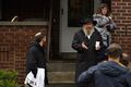 A Jew panhandles for relief donations while pimping his wife (seen at rear)